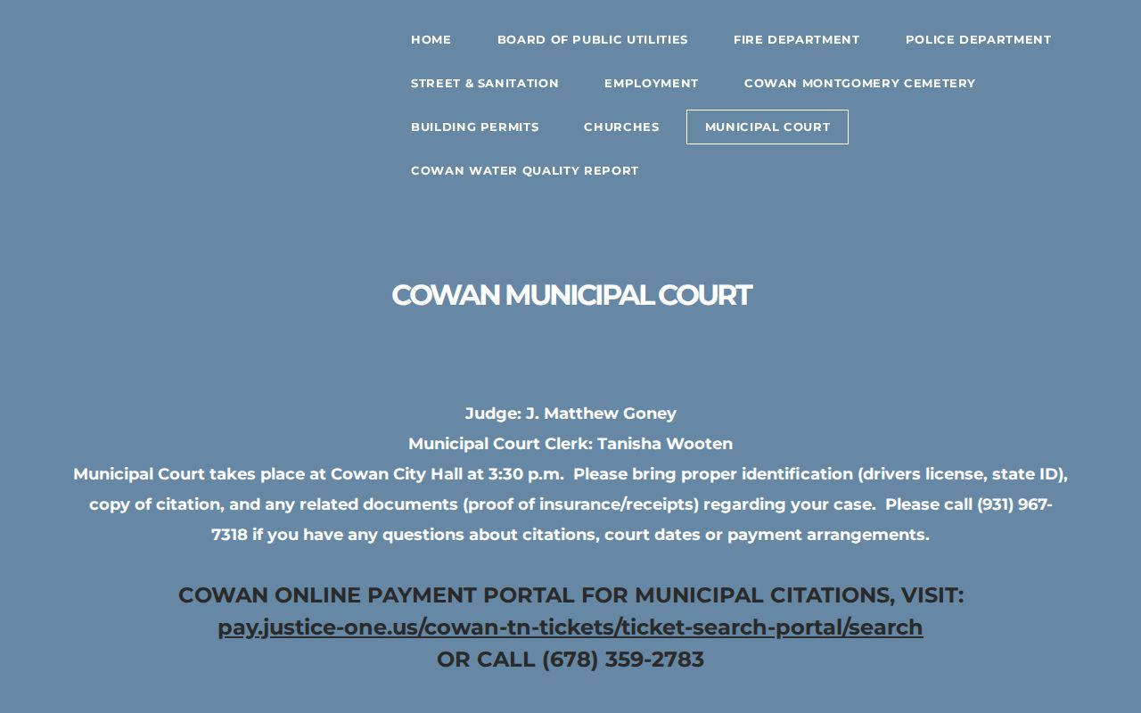 Cowan warrant records reader reviewing the municipal court calendar